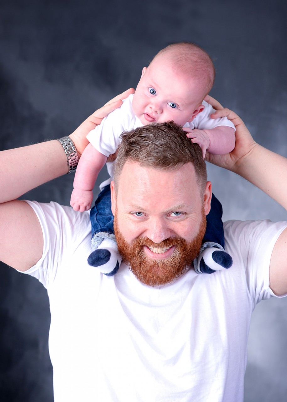Must you be getting impatient to meet baby Henry? Here he is – the sweetie pie everyone wants to cuddle. He looked handsome in his white shirt and a pair of blue jeans. Look how he is lying on his grandpa’s shoulder, completely unaware of the environment around him. This is why children are so special. They live in the moment and are peaceful with whatever they have got.  Grandpa is all love, looking at his grandson. He seems to be lost in those blue eyes. That’s how grandpas feel when they hold their grandsons.