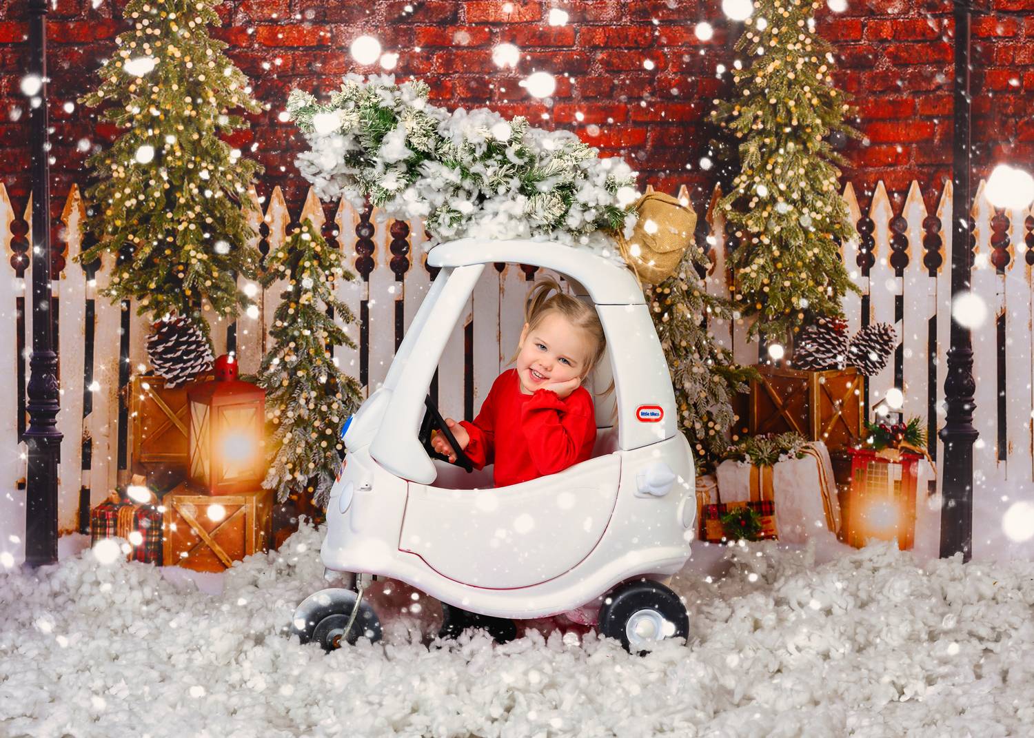 Driving Home for Christmas | Glasgow Family Photography Little girl in a Christmas car at a festive photography studio in Glasgow